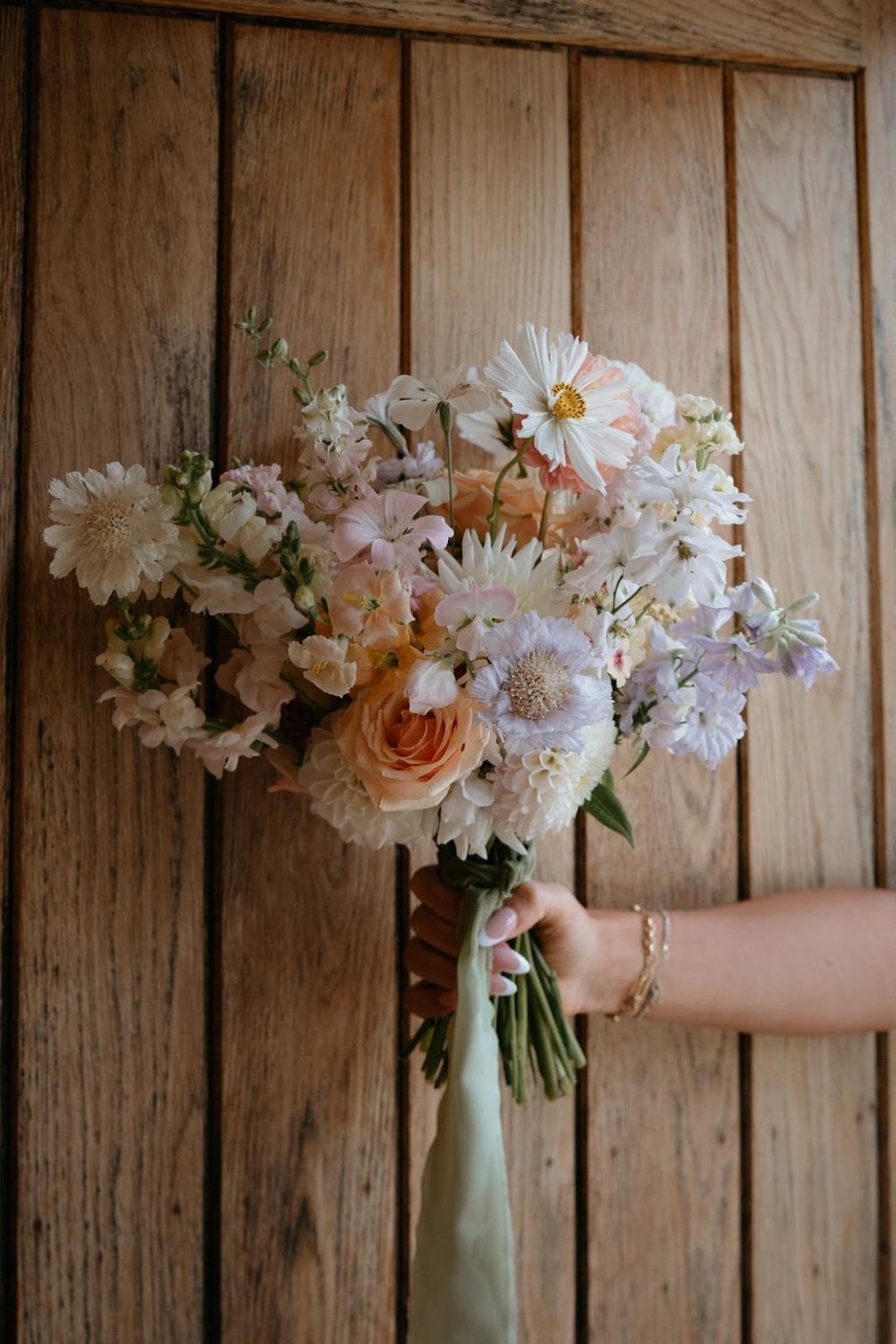 Cotswolds wedding flowers, Kingscote Barn wedding flowers, Gloucestershire wedding florist, Tetbury wedding flowers, pastel wedding bouquet, Cotswolds wedding florist, barn wedding flowers UK, rustic wedding flowers Cotswolds, romantic wedding flowers Gloucestershire, seasonal wedding flowers Cotswolds, pastel bridal bouquet UK, floral meadows wedding decor, ceremony flowers Cotswolds, barn wedding florals UK, flower-filled Cotswolds wedding, wedding bud vases Cotswolds, wedding top table flowers UK, Kingscote Barn florist, eco-friendly wedding flowers UK, natural wedding flowers Cotswolds, wildflower wedding bouquet Cotswolds, buttonholes wedding flowers UK, bespoke wedding flowers Cotswolds, floral design for Cotswold weddings, wedding aisle flowers Cotswolds, Gloucestershire floral designer, elegant wedding flowers Cotswolds, countryside wedding flowers UK, soft romantic wedding florals, garden-style wedding flowers Cotswolds, Cotswold flower arrangements for weddings, repurposed wedding flowers UK